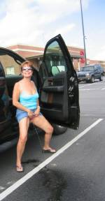 Pig pissing in a shopping mall lot