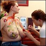 Redhead plumper enjoying her big tits painted